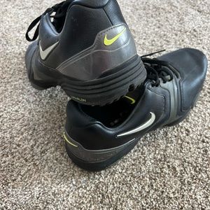 Black and green size 12 mens Nike golf shoes.